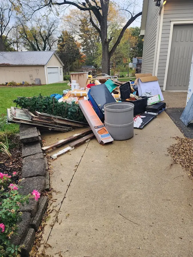 Dumpster being loaded with debris for 3 Yard Dumpster Rental in Hackettstown